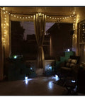 Cozy patio with Battery Operated 25 Feet 100 LED Warm White Hanging String Lights With 20 Bulbs Remote Dimmable Eight Modes Memory Timer Waterproof And Shatterproof For Indoor Outdoor Decor Perfect For Bedroom Patio Balcony Home And Christmas Party illuminating the space.