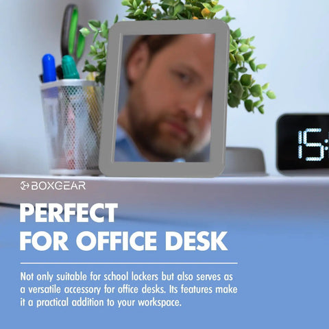 Gray Magnetic Locker Mirror Grab And Go 5 By 7 Inches on office desk with plant and clock