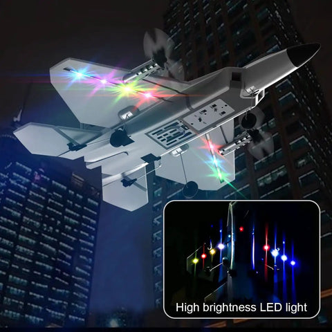 F22 Style 4 Channel RC Airplane with Xpilot Stabilization flying at night, featuring colorful LED lights and dual battery pack.