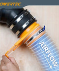 Close-up of 4 Inch Clear Spiral Dust Collection Hose connected to a black coupling, PVC material showing airflow direction.