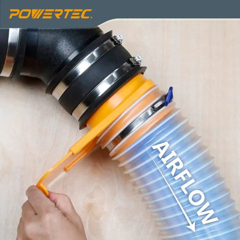 Close-up of 4 Inch Clear Spiral Dust Collection Hose connected to a black coupling, PVC material showing airflow direction.