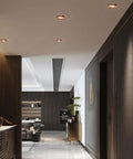 Recessed lighting in a stylish corridor with rose gold trim and modern decor, showcasing saditesdk 15 Pack Recessed Lighting Housing Trim Kits.