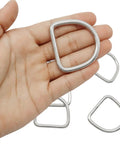 10 Pack Stainless Steel D Ring 1.5 Inch Beefy Heavy Duty Welded Rings For Tie Downs And Lashing Seamless Weld Construction No Weak Spots Load Bearing Hardware For Trailers Camping Gear Outdoor Projects, close-up in hand