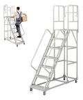 Badass Heavy Duty Seven Step Rolling Ladder With Reinforced Steel Handrails And Easy Glide Wheels For Warehouse Garage Storage Access 1500 LB Capacity Non Slip Platform That Handles Loads Like A Dream in use with a worker carrying a box.