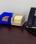 Space Saving Stackable Plastic Storage Bins For Garage And Pantry No Fuss Organization Bins on desk with phone
