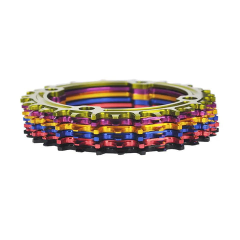 Colorful stack of Wide Range Narrow Wide 104 BCD Mountain Bike Chainring 32T 34T 36T 38T Round Aluminum 7075 T6