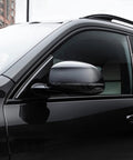 Auto paint clear coat for cars; glossy black exterior with side mirror.