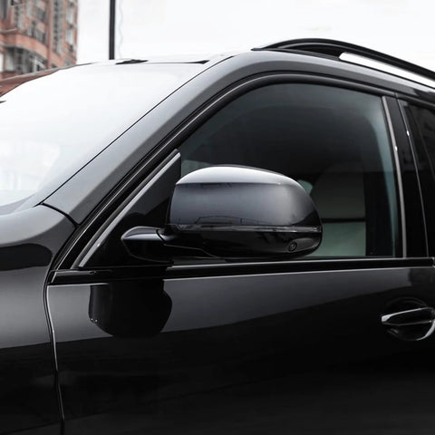 Auto paint clear coat for cars; glossy black exterior with side mirror.