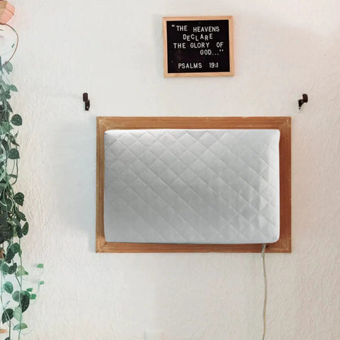 Quilted double-insulated cover on window AC unit, part of 2 Pack Indoor Window AC Cover For Window Units With Double Insulation And Free Elastic Straps Dust Proof Debris Guard To Extend Your AC Life And Make Cleaning A Breeze Easy To Install, mounted under decor wall sign.