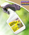 Hand holding Hot Pepper Wax Animal Repellent Spray 32 Oz Ready To Use Keeps Deer Rabbits And Squirrels From Nibbling Your Lawn And Garden Plants With Cayenne Pepper And Capsaicin For Easy Pest Control.