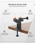 Compact Mini Bench Vise Perfect For Jewelry Making And Model Building, Durable PP Plastic Desktop Clamp holds parts steady for precise work.