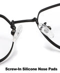 Close-up of No Sweat Silicone Eyeglasses Nose Pads on black frame glasses, showing two clear screw-in nose pads.