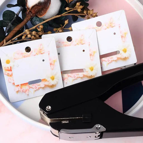 Portable Oval Hole Puncher 1 Inch Hole Size, 10 Sheets Capacity, shown with punched cards