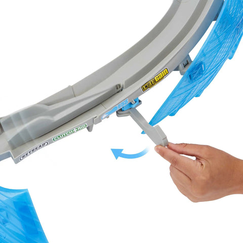 Close-up of a hand operating the diverter on the Ultimate Florida Speedway Track Set With Lightning McQueen Car And Motorized Booster.