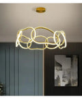 Modern Stainless Steel Creative LED Pendant Lamp Luxury Living Room Restaurant Bedroom Hotel Minimalist Chandelier Decor Light in gold finish, showcasing unique design.