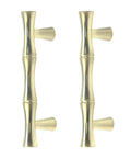 Set of four bamboo shape cabinet pulls in brushed gold finish, shown vertically, 2.5-inch center hole, 3.7-inch total length.