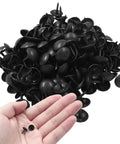 Heavy Duty Matte Black Upholstery Tacks In Two Hundred Pack Featuring Smooth Nine Millimeter Caps for DIY projects shown in hand.