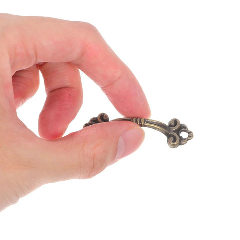 Hand holding Retro Drawer Knobs Vintage Jewelry Box Pulls Metal Cabinet Handles furniture hardware