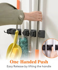 Mop and Broom Holder Wall Mount Anti Slip Hanger for Cleaning Supplies Organizer installed on wall with tools secured in slots