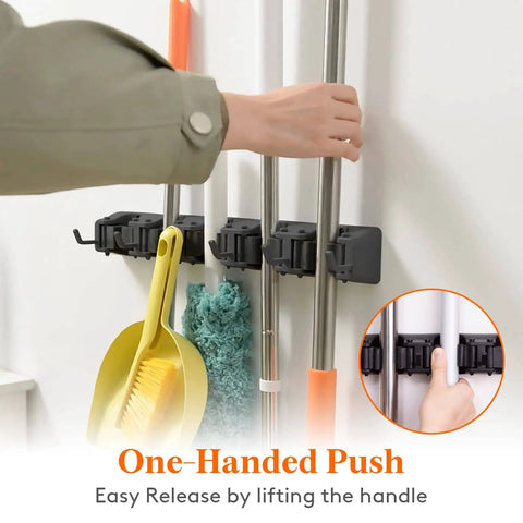 Mop and Broom Holder Wall Mount Anti Slip Hanger for Cleaning Supplies Organizer installed on wall with tools secured in slots