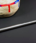 Side view of a 12-inch carbide woodturning tool with a metal shaft and round cutter tip
