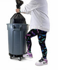 Heavy Duty Trash Can Dolly With Five Casters And Foot Stabilizer Plastic Utility Cart That Fits 20 To 55 Gallon Brute Containers Supports Up To 460 Lb Durable Black Finish For Easy Transport holding a 20-55 gallon trash can