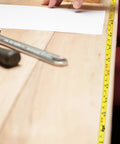 Top Shelf Adhesive Measuring Tape Kit For Woodworking Sweet Sticky Metal Ruler Premium Carbon Steel Tape Measure Peel And Stick Tool laying on a wooden surface with tools.