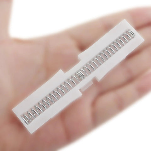 Two Piece White ABS Sliding Guide Rails Kit For Double Folding Doors Top Track Hardware in hand, showcasing spring mechanism.