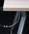 11.5 Inch Flexible Drill Bit Extension With Right Angle Adapter shown working in tight space under table