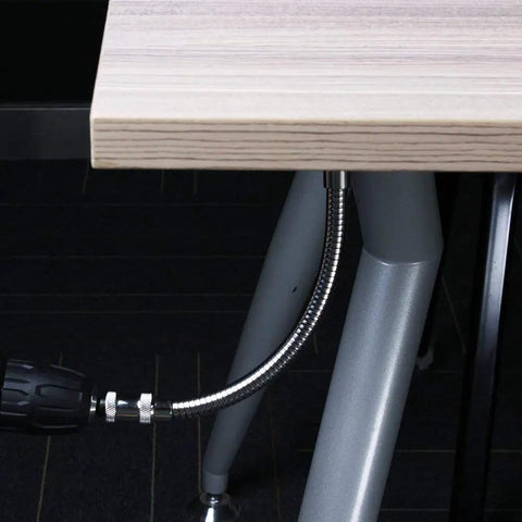 11.5 Inch Flexible Drill Bit Extension With Right Angle Adapter shown working in tight space under table
