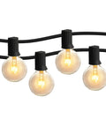 Close-up of glowing bulbs from the 50ft Outdoor String Lights With 52 G40 Bulbs Incandescent Warm White 2200K on black wire.