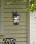 Outdoor Wall Sconce Lighting Fixture Finished In Black With Seeded Glass Set Of 2 For Exterior Walls Perfect For Entryways Porches Patios And More Durable Metal Exterior Lighting 7.5 In Tall 6.5 In Wide 12.2 In High mounted on exterior wall