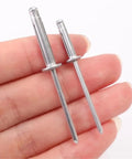 Two aluminum alloy blind rivets from the 200-piece M4 kit for wood, plastic, metal car repair and DIY projects.