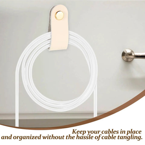 Slick Double Pack PU Leather Cord Organizer Ties For Reusable USB Charger Straps and Earphone Holders, beige leather strap holding white cables.