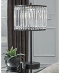 27 Inch Modern Glam Crystal Table Lamp In Black with crystal beaded drum shade on glass table near window in living room.