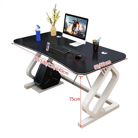 Solid Multifunction Computer Desk With Nifty Cable Management Hole Ergonomic Arched Edge Compact Gaming Workstation Total Game Changer For Tiny Rooms Waterproof Black Surface 47 Inches Wide with sleek design, monitor, and accessories.