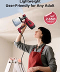 Person using Electric Paint Sprayer With 3 Spray Patterns And 4 Brass Nozzles for ceiling, showcasing lightweight design.