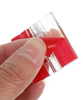 Close-up of red adhesive layer on Six Pack SelfAdhesive Acrylic Cabinet Hinges Foldable 35x25mm for Kitchen Cabinets Simple Install and Smooth Flip.