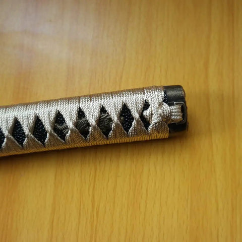 Close-up of Samurai Katana Tsuka Handle 10.2 Inch Do It Yourself DIY Grip Upgrade with woven wrap and alloy fittings on hardwood core.