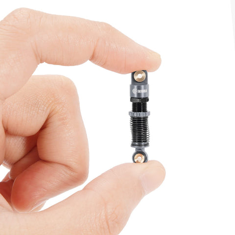Hand holding 51mm Long Travel Shocks For Axial AX24 SCX24 RC Crawler Upgrade Double Barrel Threaded Dampers CNC Machined Aluminum Bodies