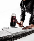 Pro Grade Heavy Duty Soft Faced Mallet With Dual Inserts Rubber Black Medium Hard And White Superplastic used on stone