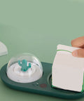 Smart Electric Cup Warmer Base with Three Adjustable Heat Modes holding a milk carton, stylish design with cactus detail.