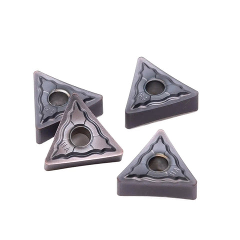 Check Out These 10 Pc Indexable Carbide Lathe Tools With Tough TNMG160408 Inserts And A Super Sharp Edge That Rocks On Stainless Steel Plus Heavy Duty Hard Alloy Turning Blades For All Your Metal Fabrication Jobs. Close-up of TNMG160408 inserts in dark gray.