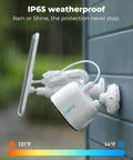 5MP Solar Outdoor Security Camera Kit With Wireless Spotlight Night Vision mounted on wall in rain, IP65 weatherproof.