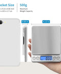 Pro Grade Digital Gram Scale 500g 0.01g Precision Kitchen Scale in hand, silver, stainless steel, backlit LCD display, pocket size