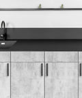 Black 5 Inch Square Cabinet Pulls 30 Pack on modern kitchen cabinets with stainless steel handles, sink, and black countertop.