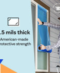 Person applying Blue Window Protection Film 24 Inch By 600 Feet For Construction Self Adhesive Temporary Glass Protection Tape