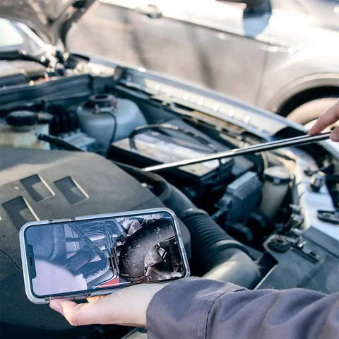 Person using smartphone camera to inspect engine with telescoping antenna; Digital Mirror With Bluetooth Camera 720P Dope LED Lighting Telescoping Antenna Micro USB Rechargeable 45 Minute Run Time Car Dash Cam Mirror Wide View Easy Setup Night Vision features