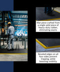 Worker standing on Diamond Flex Fire Retardant Rubber Anti Fatigue Mat For Welding Workstations Heavy Duty 40 By 64 Inch Industrial Floor Mat With Anti Slip Surface Beveled Edges Black With Yellow Border Spark Resistant Comfort For Fabrication in a welding shop.