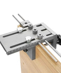 Three In One Dowel Jig Kit With Self Centering Dowel Jig, Drill Locator And Adjustable Drill clamped on wood board